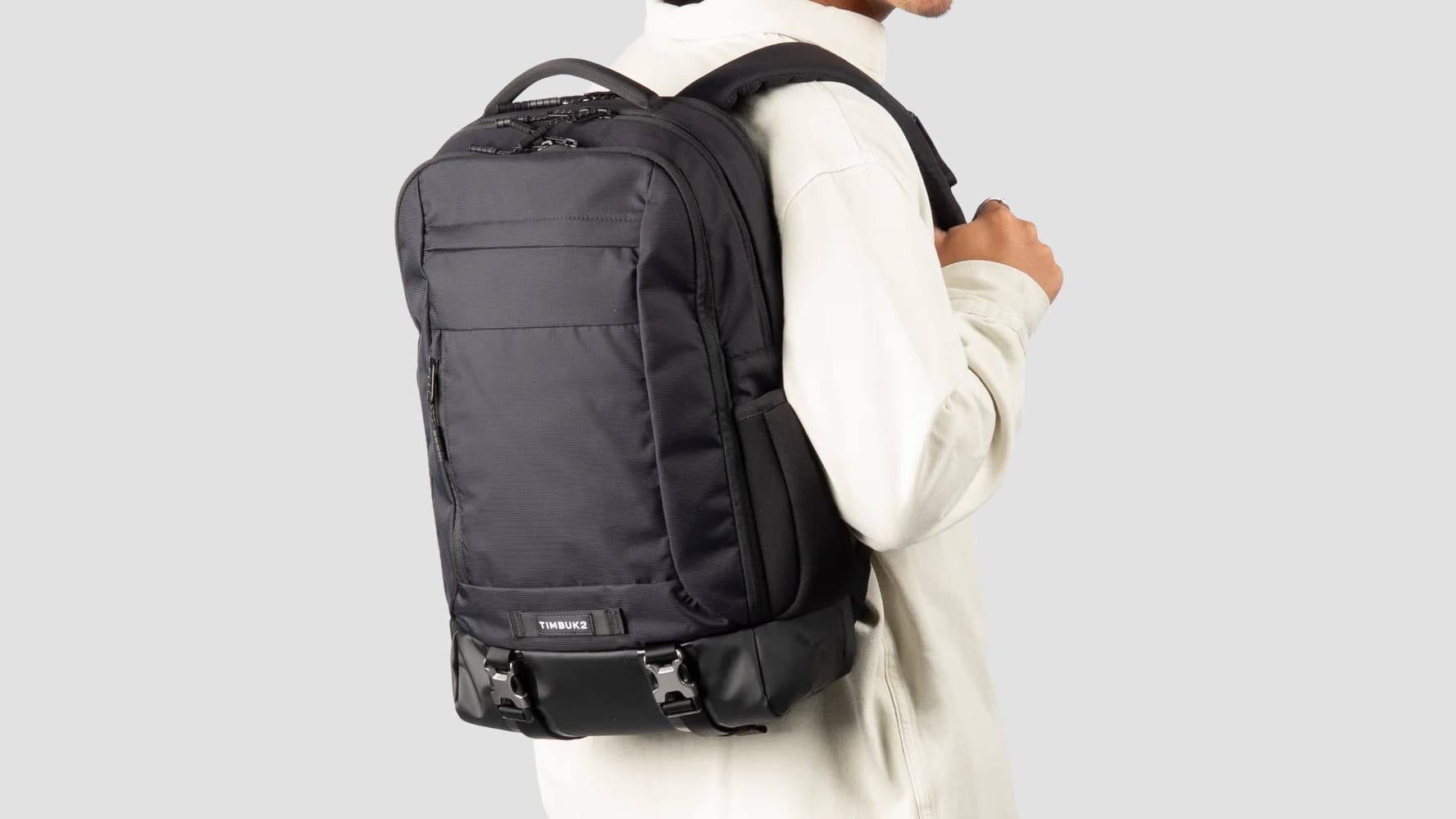 A person wearing the Timbuk2 Authority Backpack.