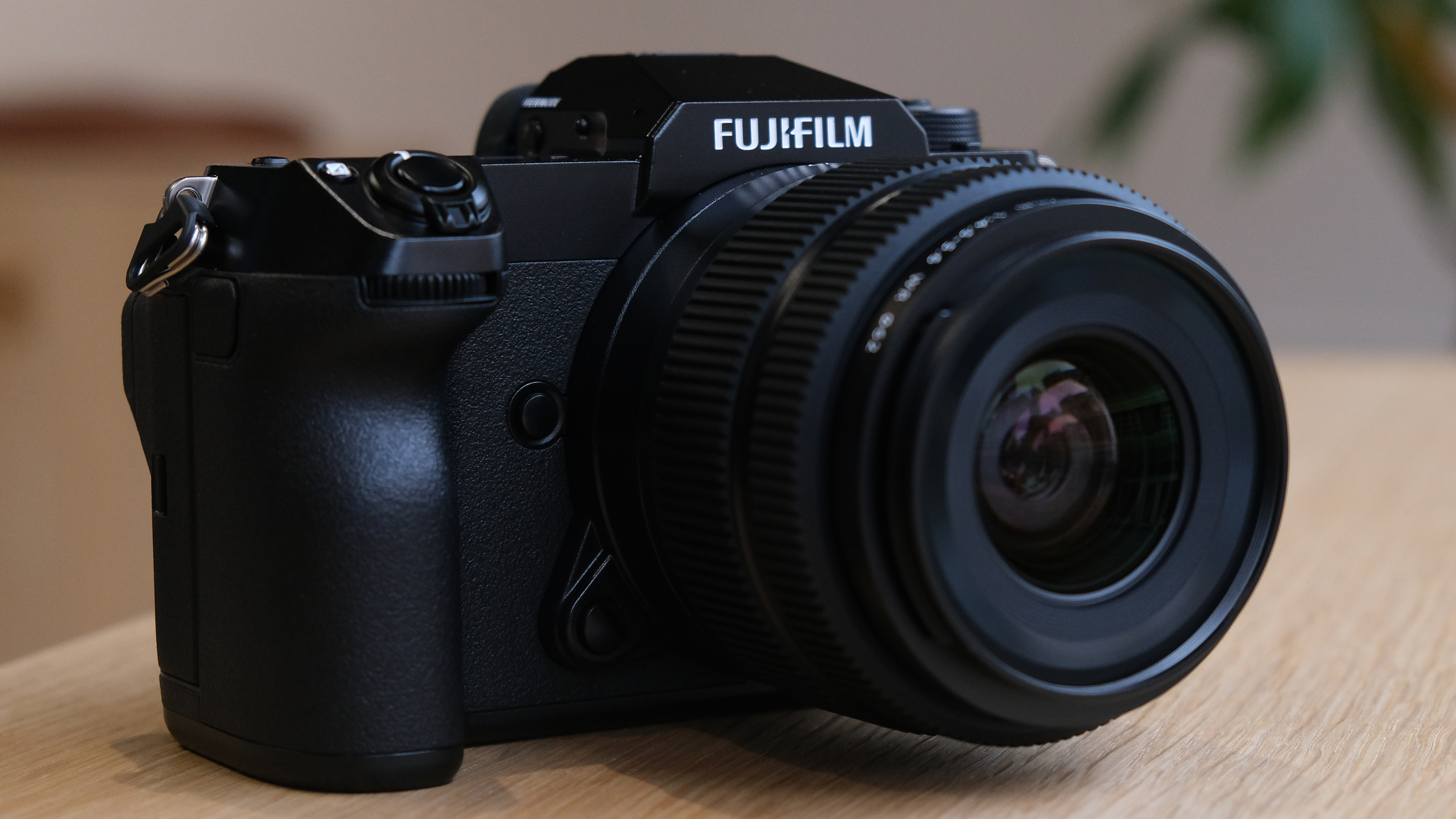 The Fujifilm GFX50S II on a wooden table