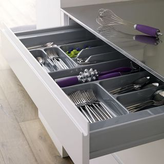 white kitchen with cutlery drawer