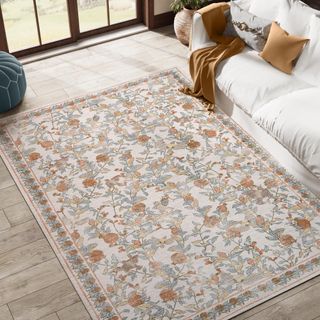 neutral floral patterned rug in living room