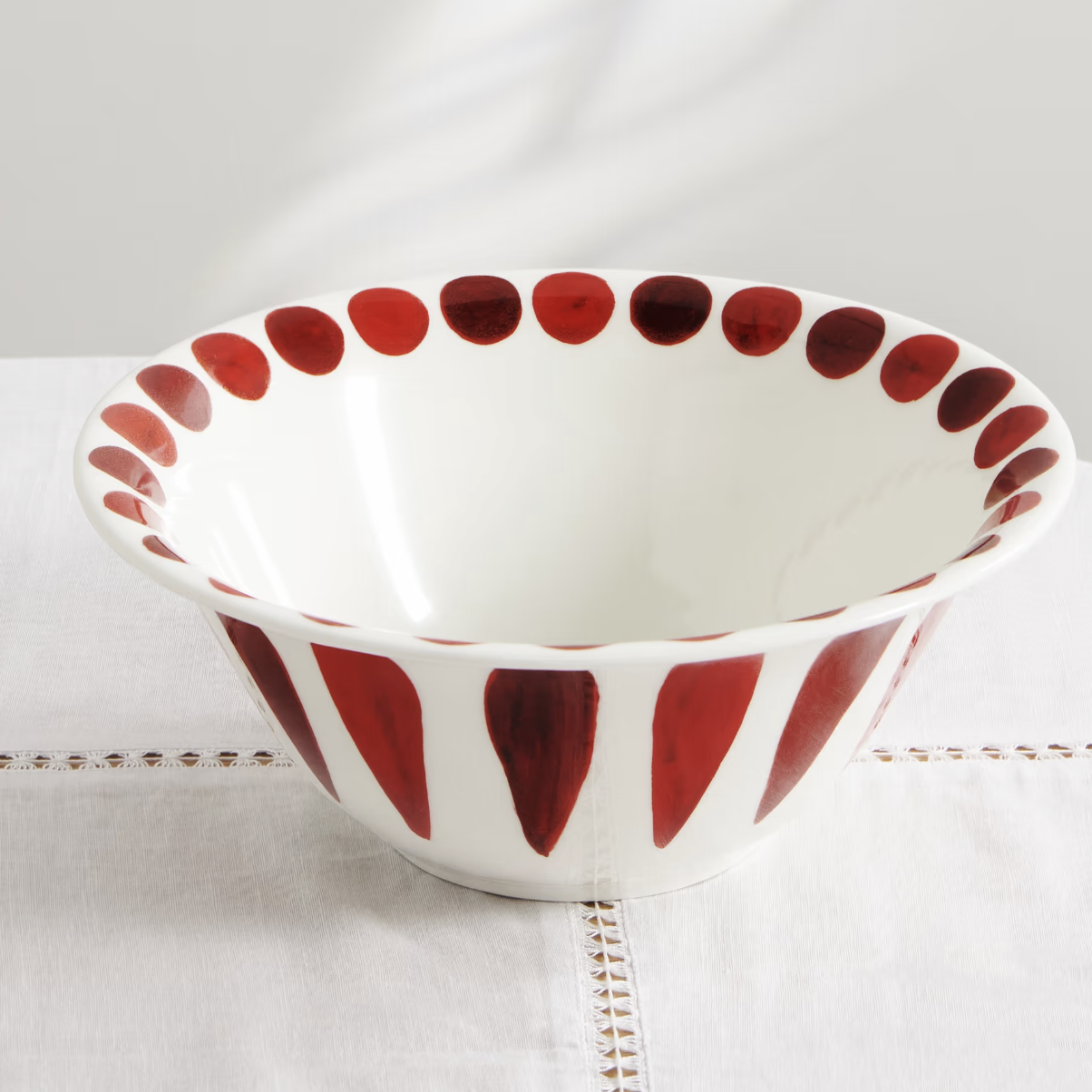 large bowl with red stripes and dots