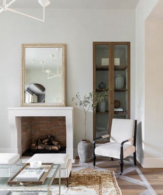 living room with white walls, rustic decor