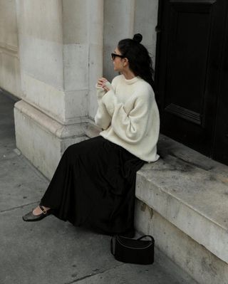 @ y.a.t.r.i wearing a black maxi skirt with white jumper