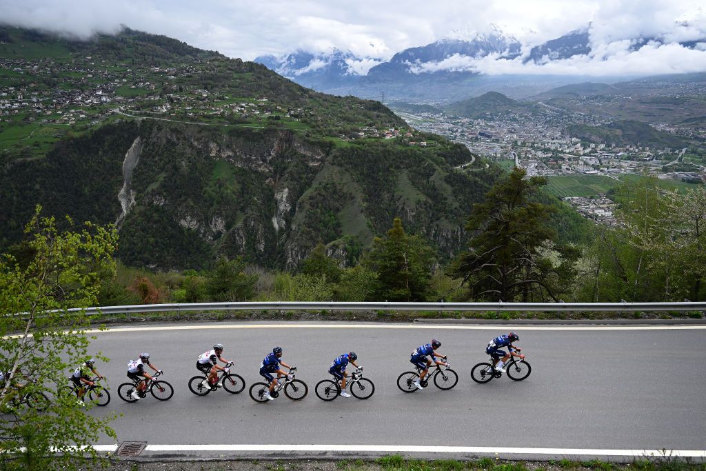 VALAIS THYON 2000 SWITZERLAND APRIL 29 Adam Yates of United Kingdom and UAE Team Emirates Reuben Thompson of New Zealand and Team GroupamaFDJ and a general view of the peloton climbing to the Mase 1317m during the 6th Tour De Romandie 2023 Stage 4 a 1616km stage from Sion to Valais Thyon 2000 2090m UCIWT on April 29 2023 in Sion Switzerland Photo by Dario BelingheriGetty Images