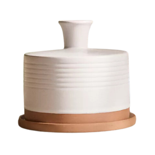 A ceramic watering bell with white glaze