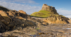 Romantic enough to stir the most pragmatic soul: Lindisfarne atop lonely Holy Island.