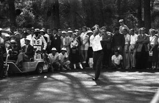 Black and white image as Arnold Palmer hits a drive in 1958