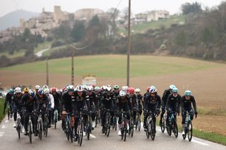 The pack of riders cycles during the 6th stage of the Paris-Nice cycling race, 209,8 km between Saint-Julien-en-Saint-Alban and Berre lâ€™Ã‰tang, on March 14, 2025. (Photo by Anne-Christine POUJOULAT / AFP)