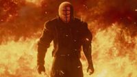 Ruiner 2 trailer still - Kill You guy standing in front of a bunch of fire