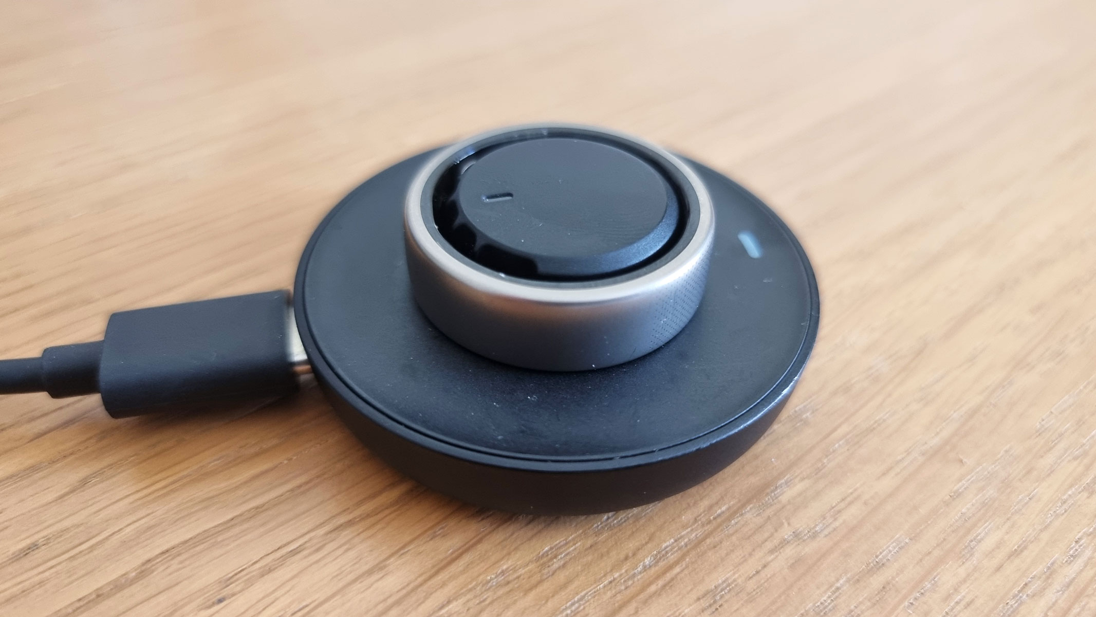 Amazfit Helio smart ring on the charging pod