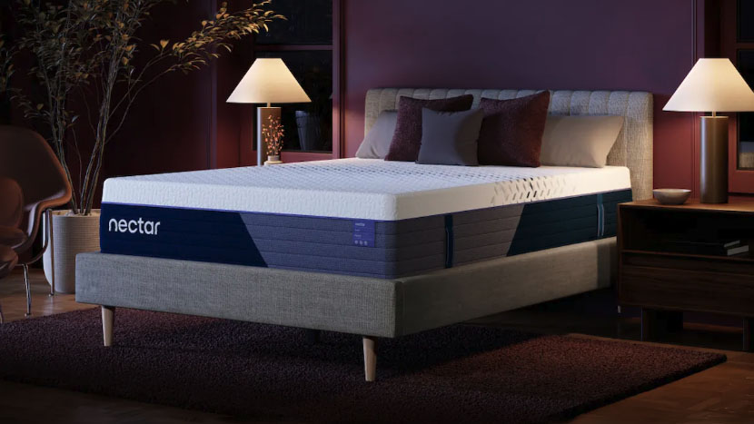 The Nectar Luxe Hybrid Mattress on a bed frame in a bedroom