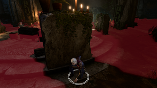 Baldur's Gate 3 character crouched behind stone block