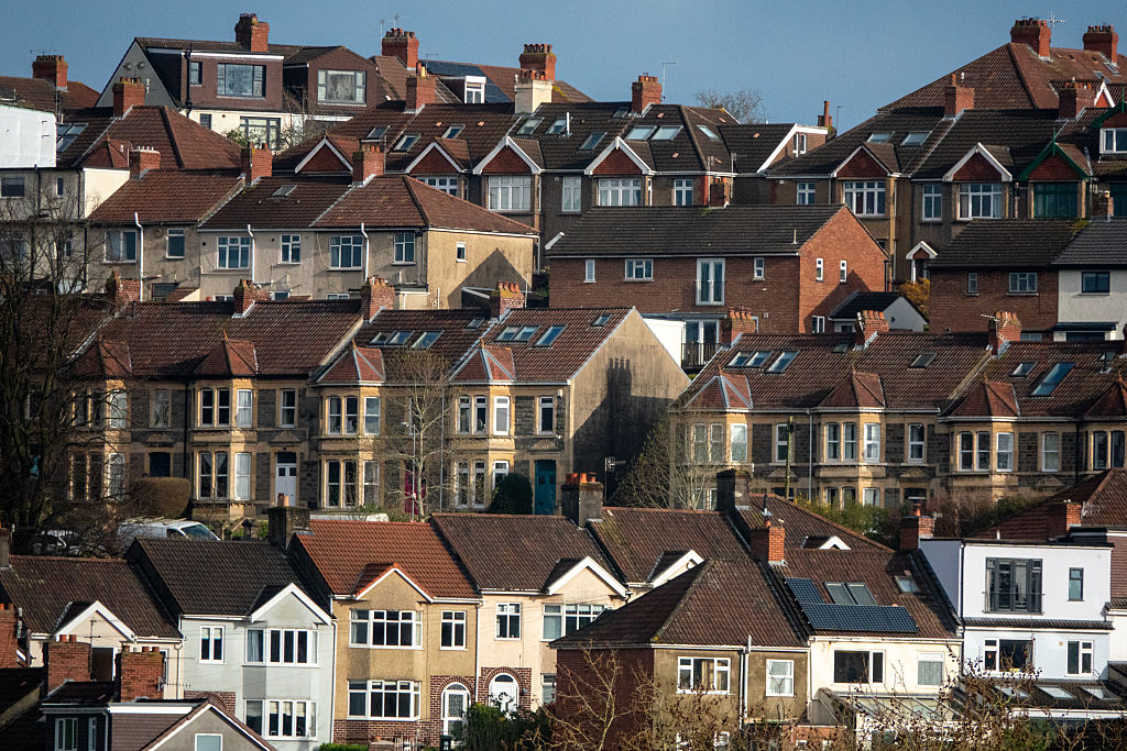 Sunlight illuminate houses in terraced streets, on March 15, 2026 in Bristol, England. How will the UK interest rates hold impact mortgage rates?