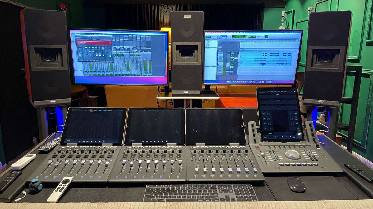 Two monitors and a mixing station with LEA Professional solutions. 