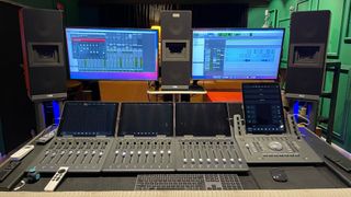 Two monitors and a mixing station with LEA Professional solutions. 