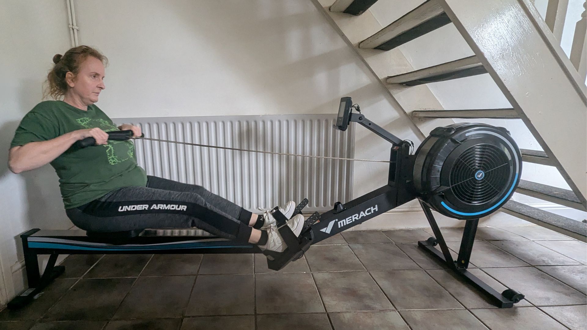 Samantha Priestley doing a rowing machine workout at home