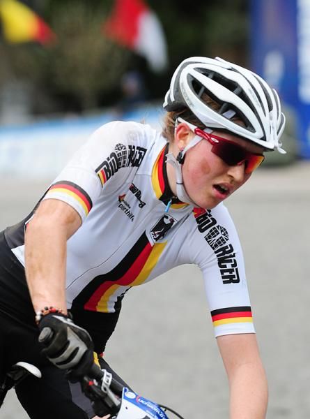 Helen Grobert (Germany) rides third with one lap to go.