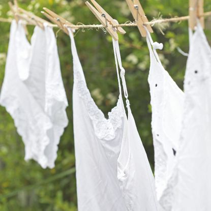 Washing line with white clothing hanging from it