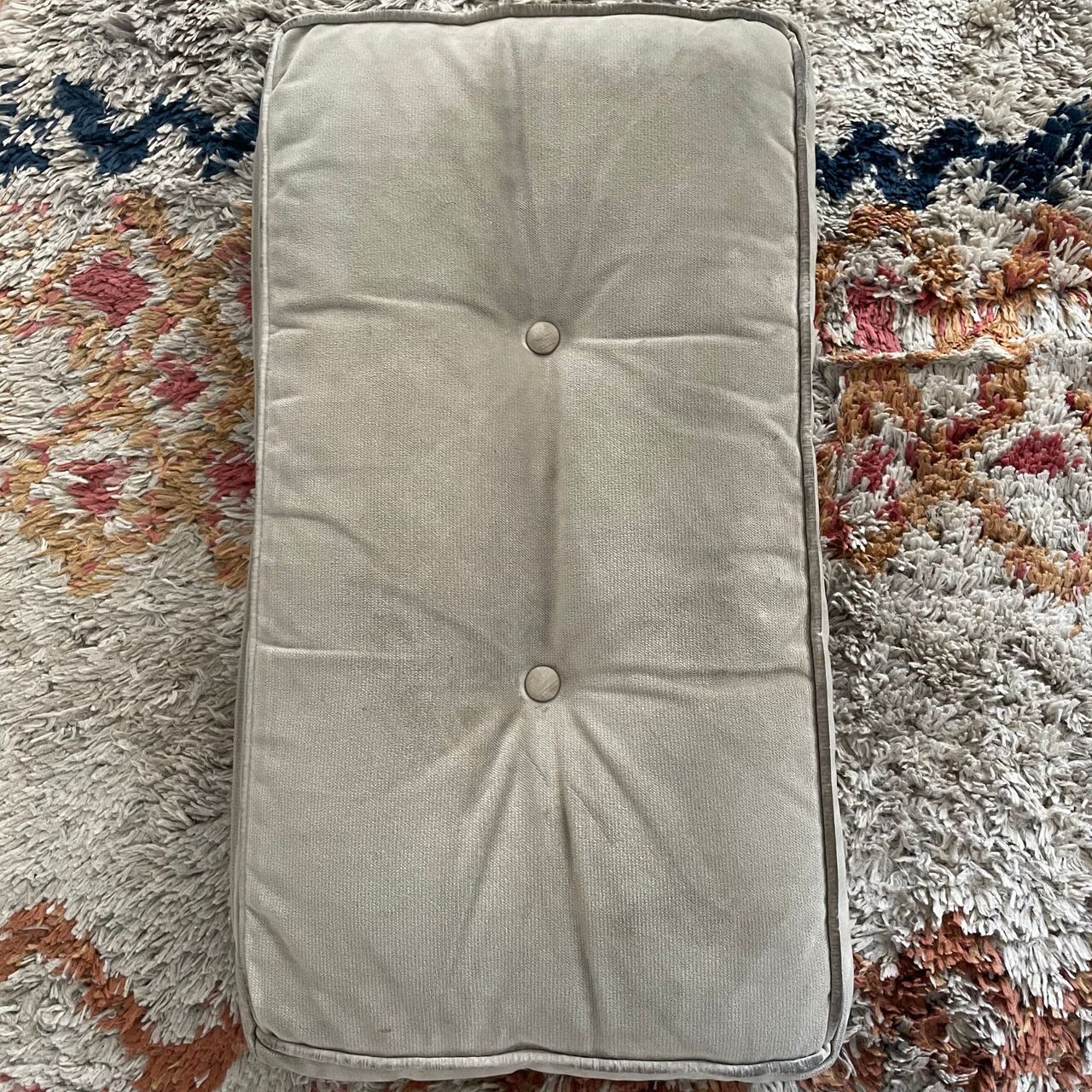 Clean beige sofa cushion after using a carpet cleaner spot cleaner on it