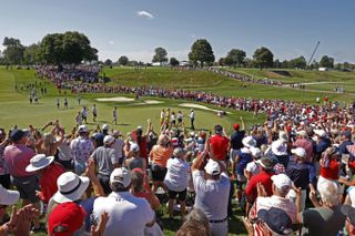 Golf fans surround the green at the 2021 Solheim Cup