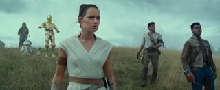 Daisy Ridley, John Boyega, Oscar Isaac in Star Wars: The Rise of Skywalker with C-3PO, BB-8, and Che