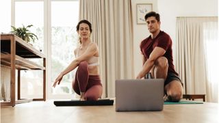 Best online fitness programs: A mother and her adult son take a FitOn yoga class at home