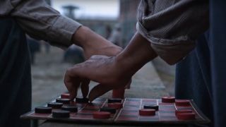 A game of checkers in progress in the yard in The Shawshank Redemption.