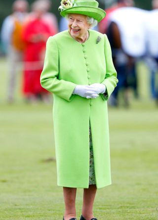 Queen Elizabeth in a lime green coat and hat