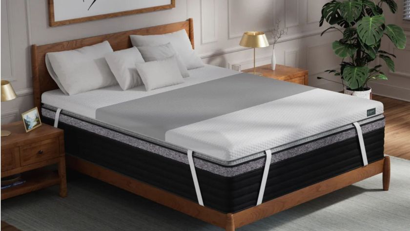 The Helix ErgoAlign Mattress Topper on a bed in a clean, well-lit bedroom. 