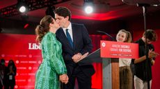 The Trudeaus kiss at a rally