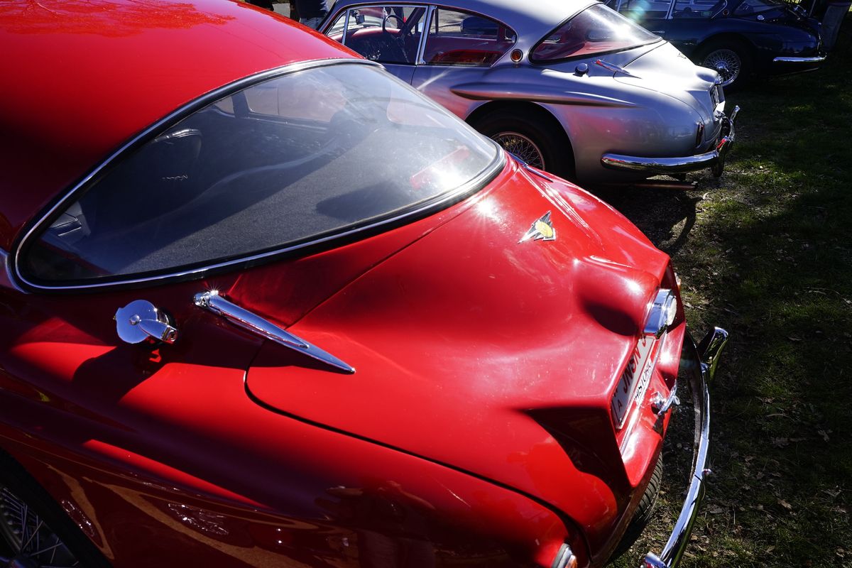 The rear of a bright red classic car