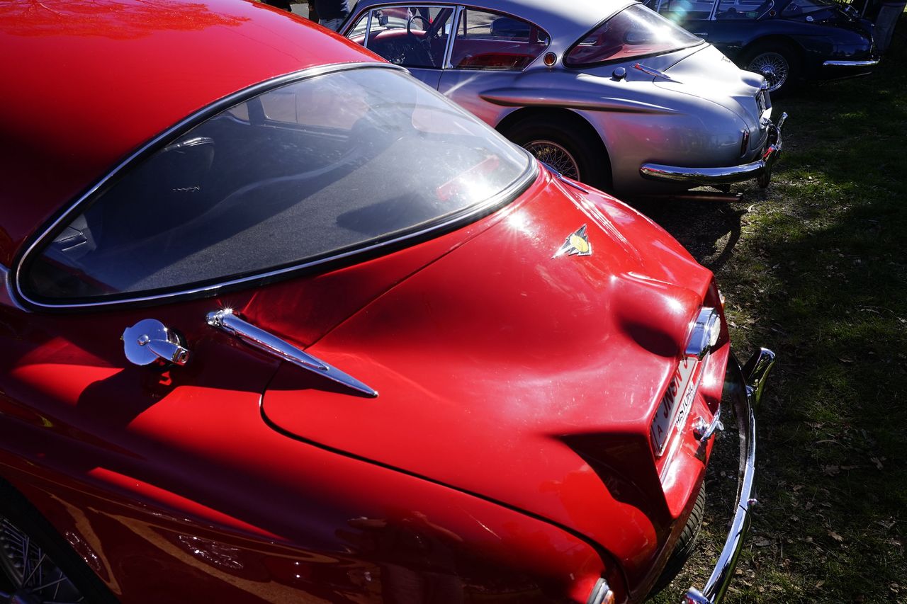 The rear of a bright red classic car