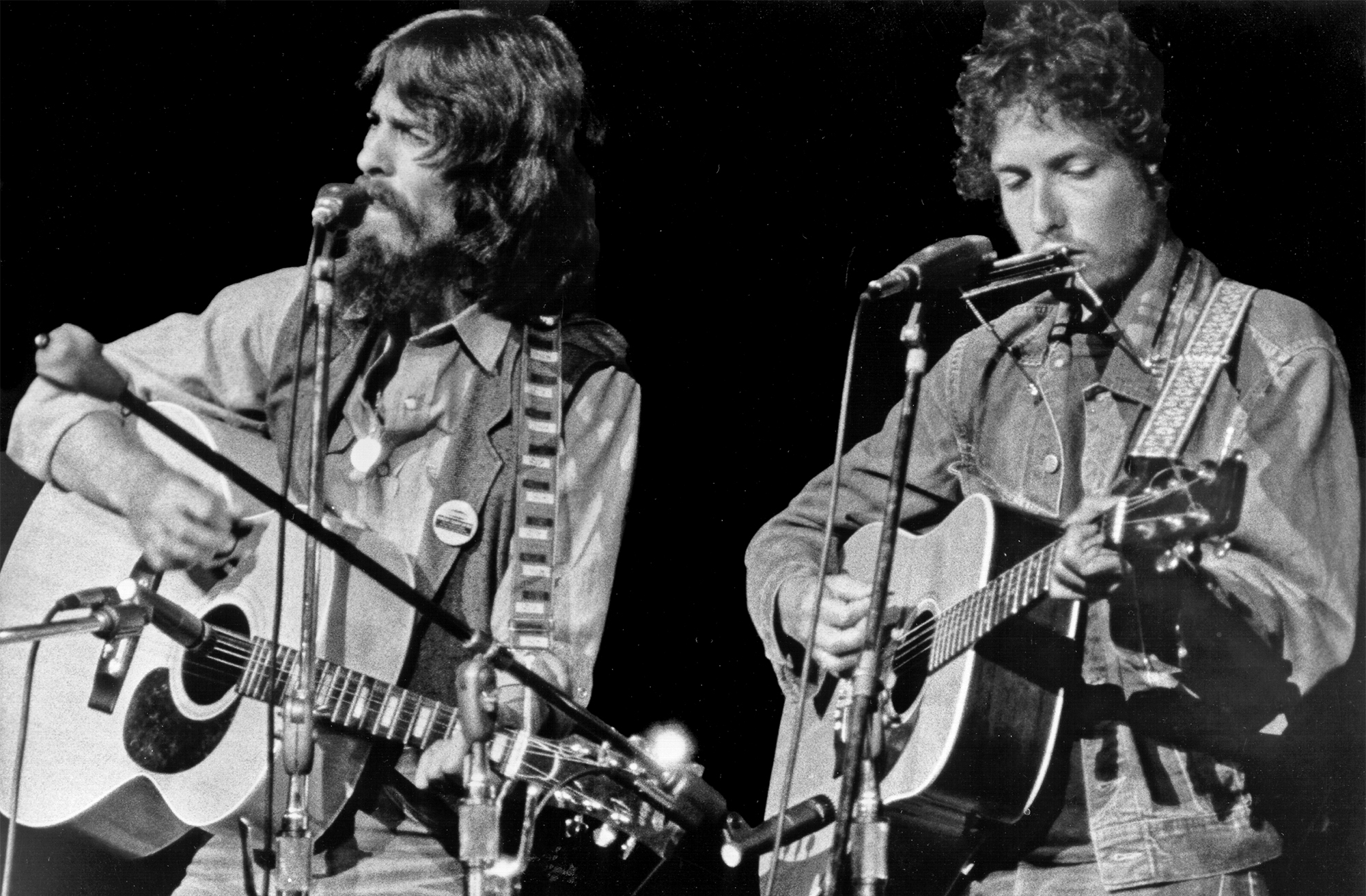 George Harrison and Bob Dylan perform onstage at the Concert for Bangladesh which was held at Madison Square Garden on August 1, 1971 in New York City, New York.