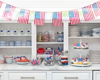 White kitchen decorate with American flag and fourth of july themed decorations