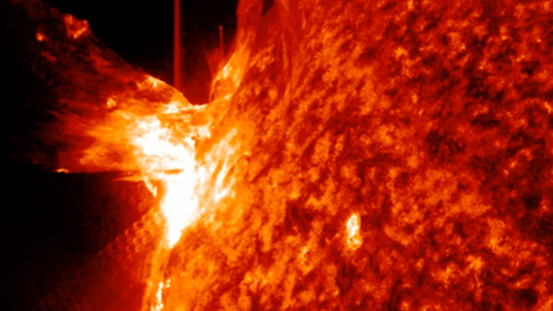 close up view of the sun emitting the giant solar flare in a fiery eruption
