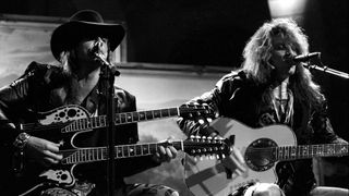 Singer Jon Bon Jovi and guitarist Richie Sambora of the hard rock group "Bon Jovi" play acoustic guitar as they performs their hit song "Wanted Dead Or Alive" during the "Slippery When Wet" tour in 1987