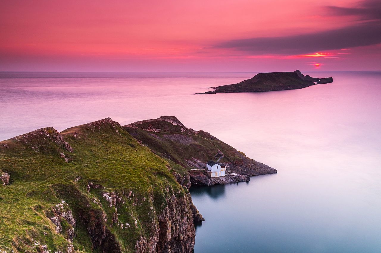 The cottage at the foot of the cliffs at Rhossili.