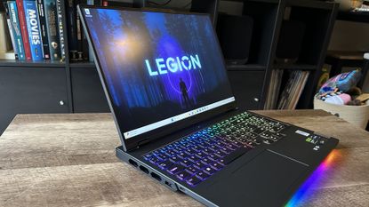 Lenovo Legion Pro 7i gaming laptop open on a wooden table
