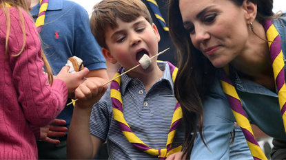 Prince Louis of Wales and Catherine, Princess of Wales toast marshmallows as they take part in the Big Help Out, during a visit to the 3rd Upton Scouts Hut in Slough on May 8, 2023 in London, England. The Big Help Out is a day when people are encouraged to volunteer in their communities. It is part of the celebrations of the Coronation of Charles III and his wife, Camilla, as King and Queen of the United Kingdom of Great Britain and Northern Ireland, and the other Commonwealth realms that took place at Westminster Abbey on Saturday, May 6, 2023.