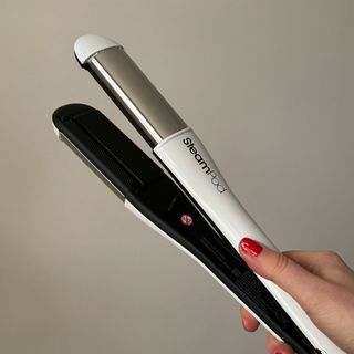 Laura holding L'Oréal Professionnel SteamPod 4 - best hair straighteners