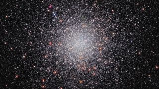 The globular star cluster NGC 6440 is glittering with stars like a swarm of bees in this stunning Hubble Space Telescope image released on Nov. 30, 2022.