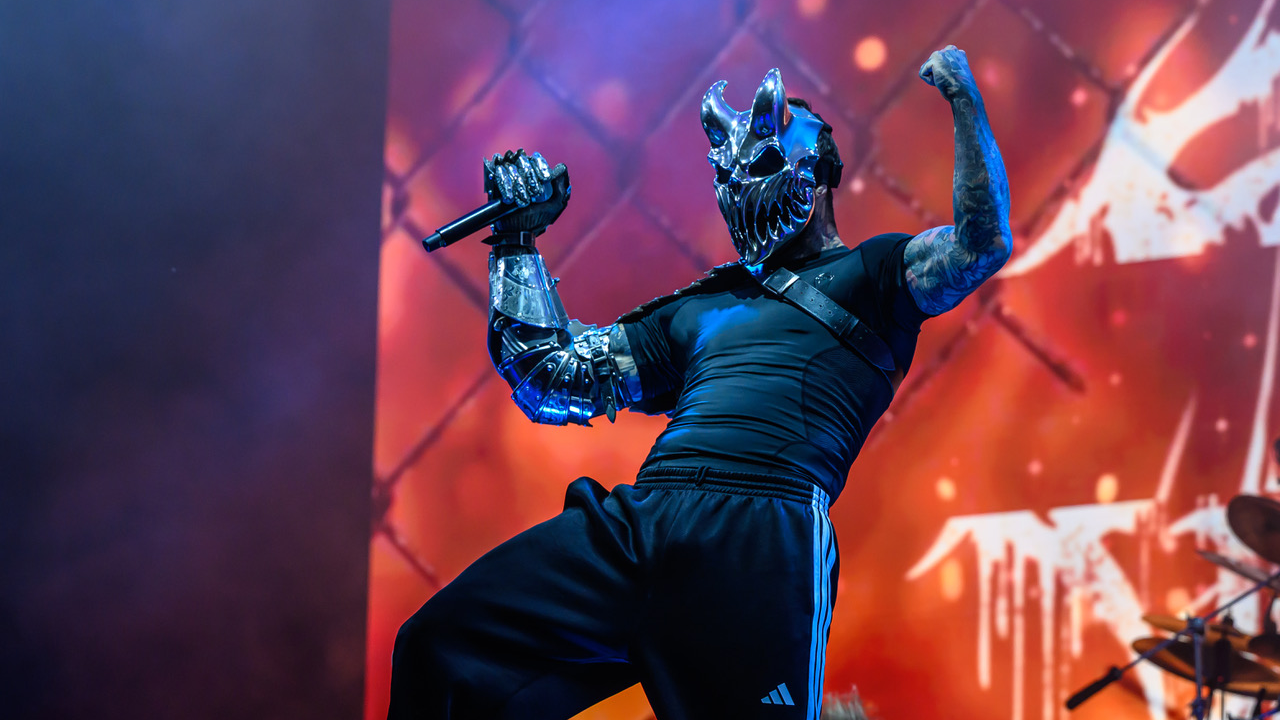 Alex Terrible in his mask posing on stage