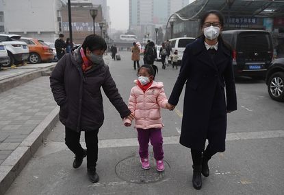 A child wears a mask in Beijing.