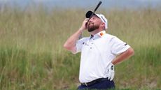 Shane Lowry puts his head in his hands