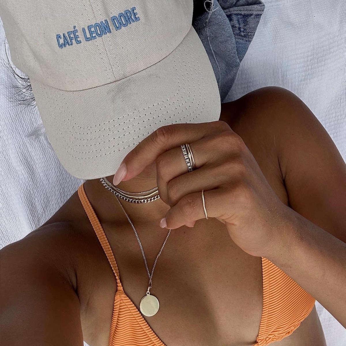 Woman sunbathing under a hat