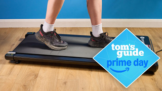 the DeerRun Q1 Mini treadmill with a person walking on the pad wearing hoka sneakers, with a tom's guide prime day deals badge
