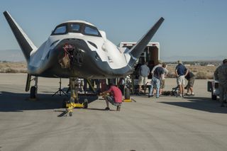 Sierra Nevada Corp.'s Dream Chaser space plane undergoes ground taxi tests at NASA's Armstrong Flight Research Center in 2013. Sierra Nevada is protesting NASA's recent award of commercial space taxi contracts to competitors SpaceX and Boeing.