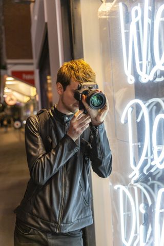 Alastair gets his camera as close to the glass as possible to get the perspective he's after.