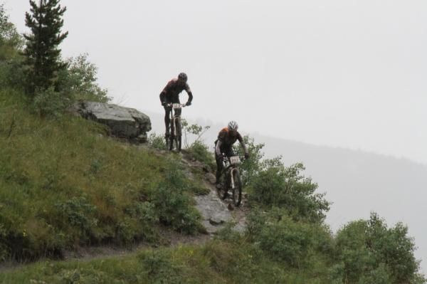 Gretchen Reeves and Cannon Shockley of Tokyo Joes ride through the mud and murk atop JumpingPound Ridge.