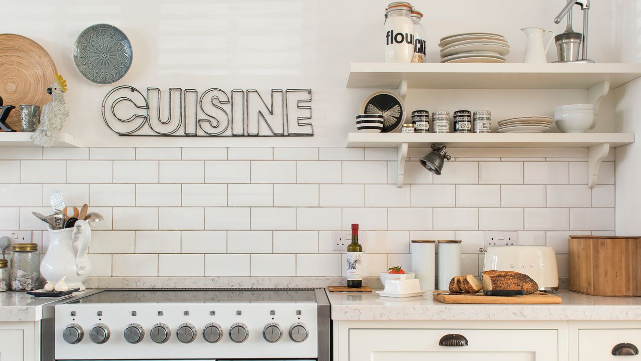 Off white kitchen with white brick tiles and wooden worktops